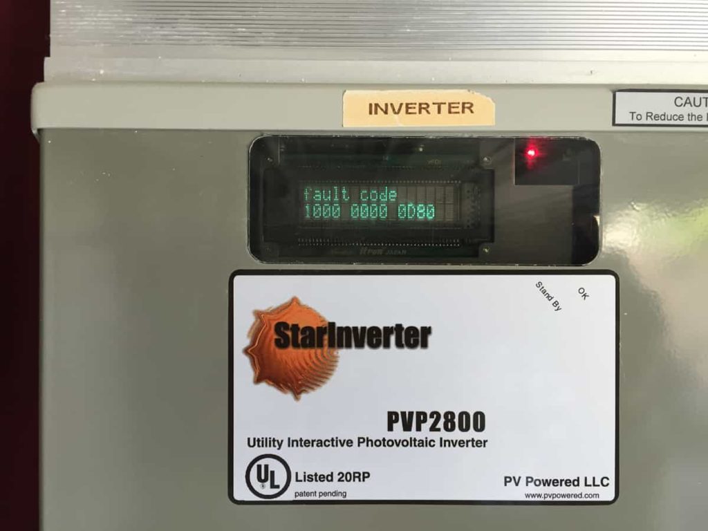Picture of a PV Powered inverter with the red status light on and the display shows a fault code.
